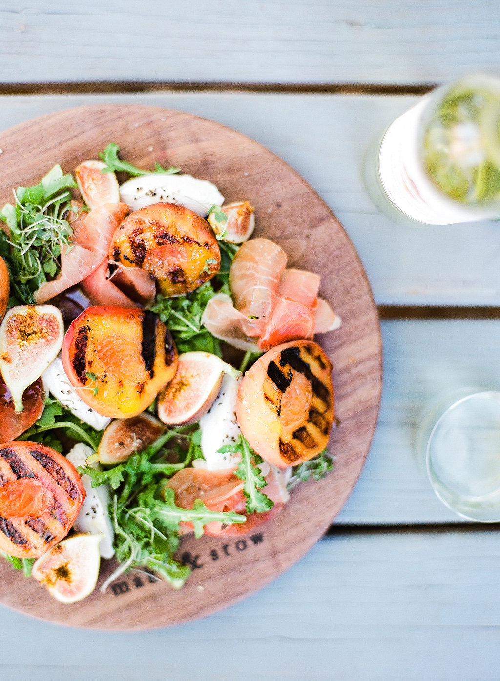 This Grilled Peach & Prosciutto Salad has that summertime citrus we all crave, it's hearty enough to satisfy even the most staunch salad nay sayers, and it's just about the perfect dish for any occasion - specifically a backyard bash!