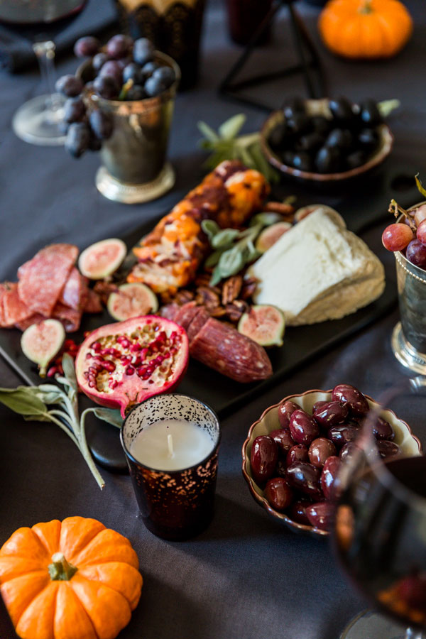 Between the witches, goblins and bats there’s still plenty of fun in a bottle of wine and a decadent, Spooky Halloween Wine & Cheese Board for your friends.