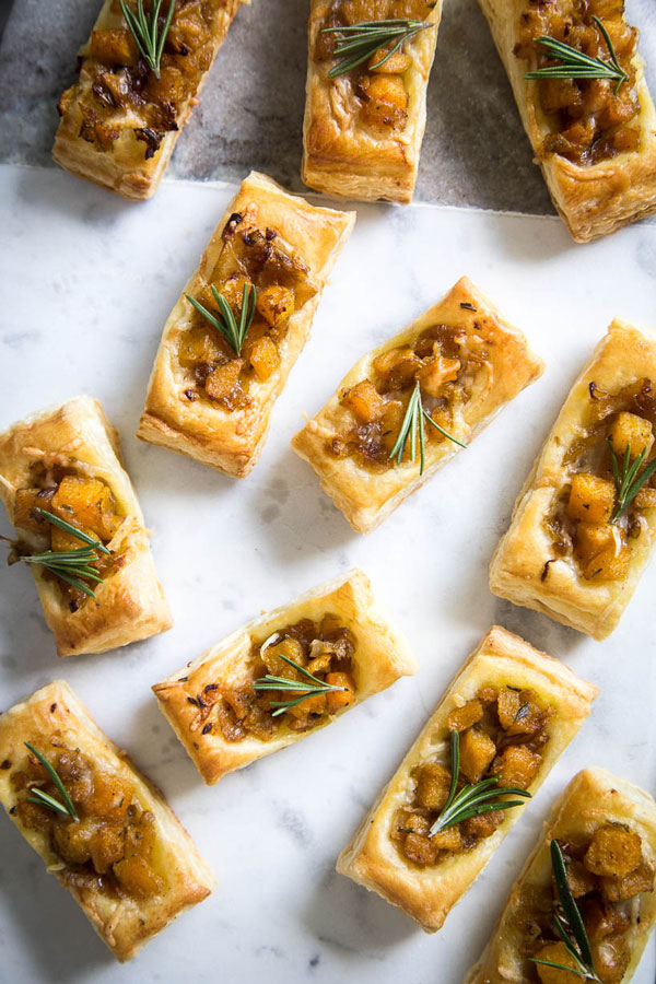 These Pumpkin & Rosemary Puff Pastry Bites are incredibly easy to pull together and make for the perfect bite-sized fall appetizer.