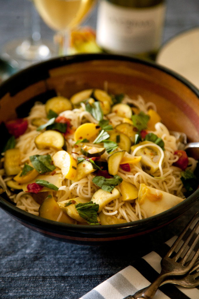 Top angel hair pasta with lightly sautéed summer squash and zucchini for a light lunch entree or first course at dinner.