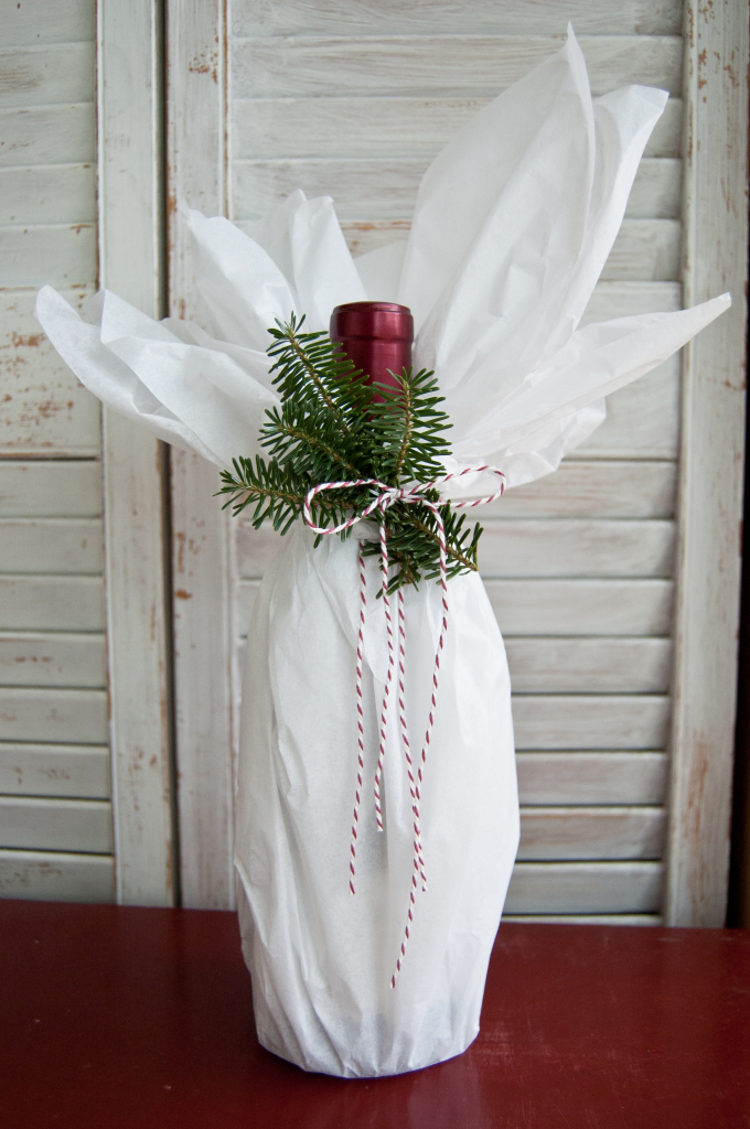 With just a touch of tissue, a twist of twine and a few sprigs of rosemary or evergreen, this bottle is ready for a classy affair.