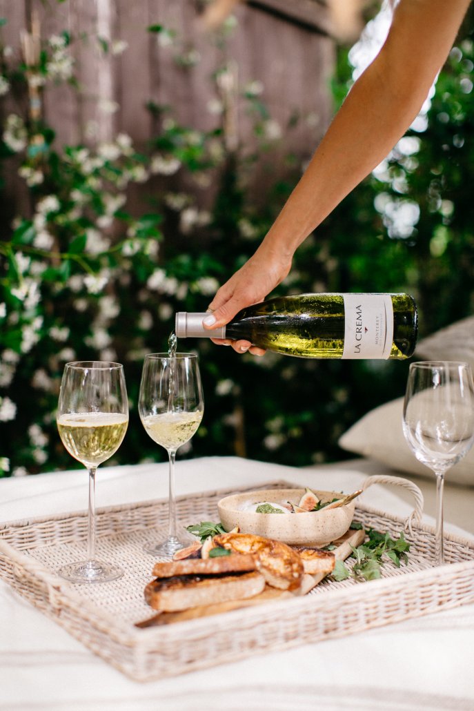 Chardonnay paired with a burrata dish as a start at a low-key dinner party by Camille Styles
