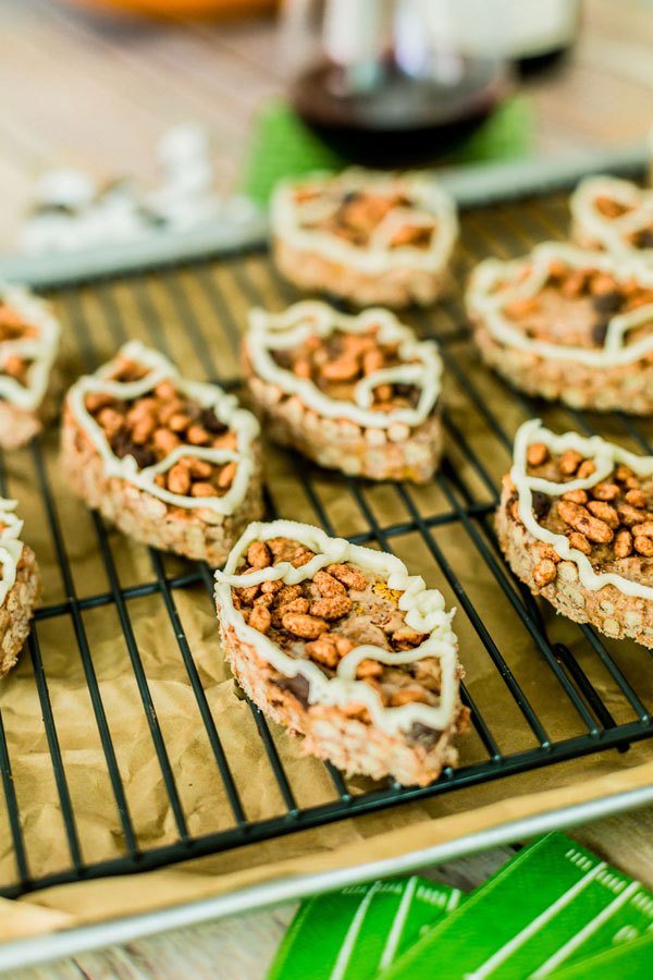 Get excited for gameday with these football shaped chocolate rice krispie treats with a marshmallow fluff drizzle.