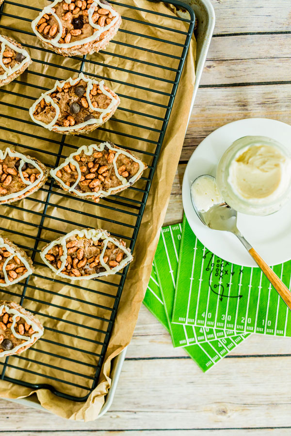 Get excited for gameday with these football shaped chocolate rice krispie treats with a marshmallow fluff drizzle.